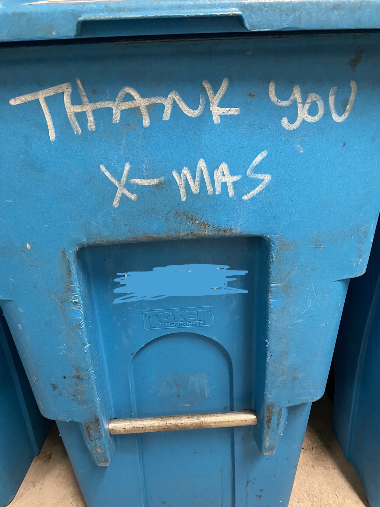 ecu a blue san francisco rolling can for recyclables that someone has written "THANK YOU X-MAS" on, in white permanent marker, for reasons unknown to me