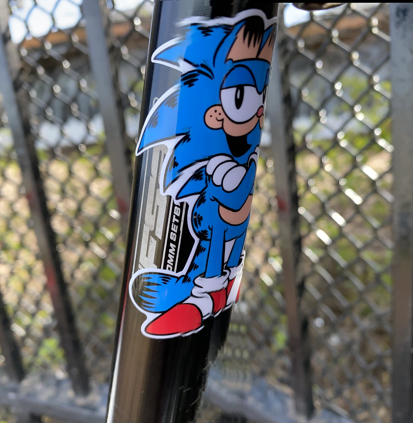 ecu: a sticker on the back of my seat post of a sonic the hedgehog / garfield chimera