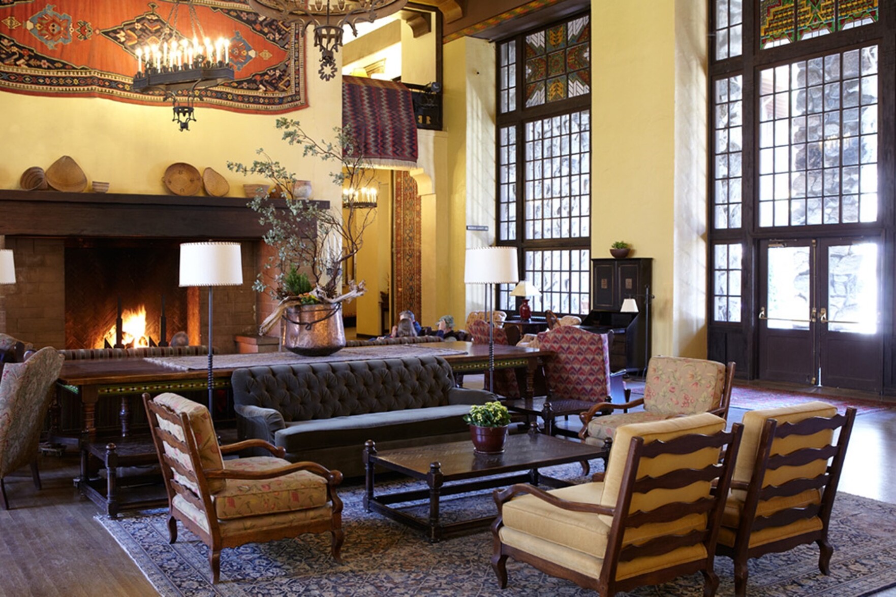 "the great lounge" room at the big, old, fancy, 20s lodge in the yosemite valley; a huge room of 20' ceilings, three great long walls of glazing looking out on a meadow, seating for hundreds, and a great big fireplace on one wall with sofas facing it, which i've personally enjoyed a great book on, in front of said fire, on a quiet evening