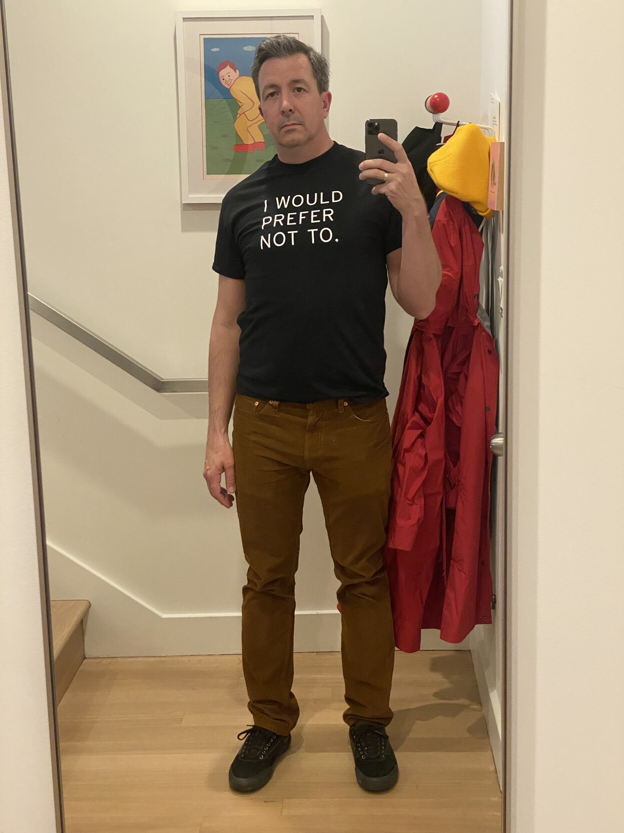 selfie, full length mirror, new black t shirt from melville house, "I WOULD PREFER NOT TO." in white block san in the front, brown levis cords, blacked out vans