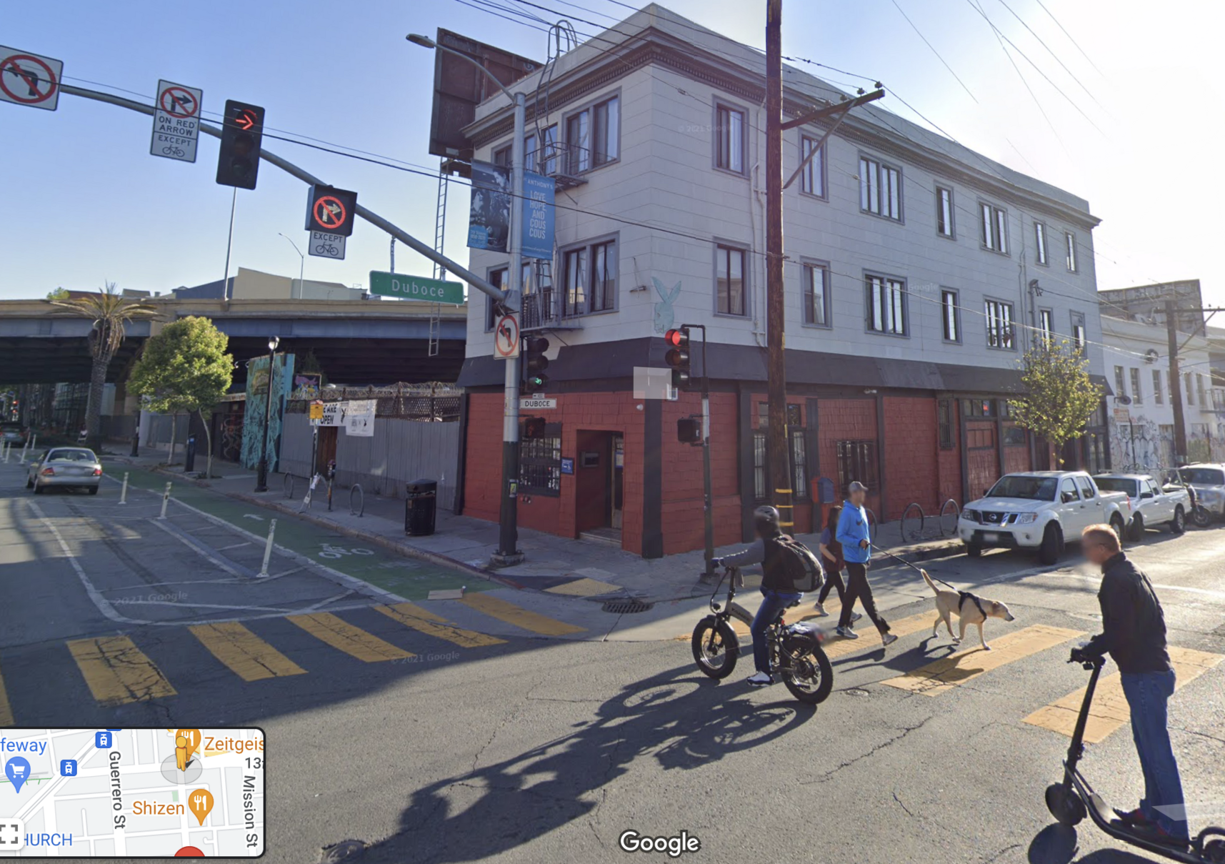 google street view of valenca northbound at 14th in the car right-turn-lane, the bike lane to it’s right, close up of Zeitgeit and the multiple redundant signs SFMTA put up, after I assume the first few failed?