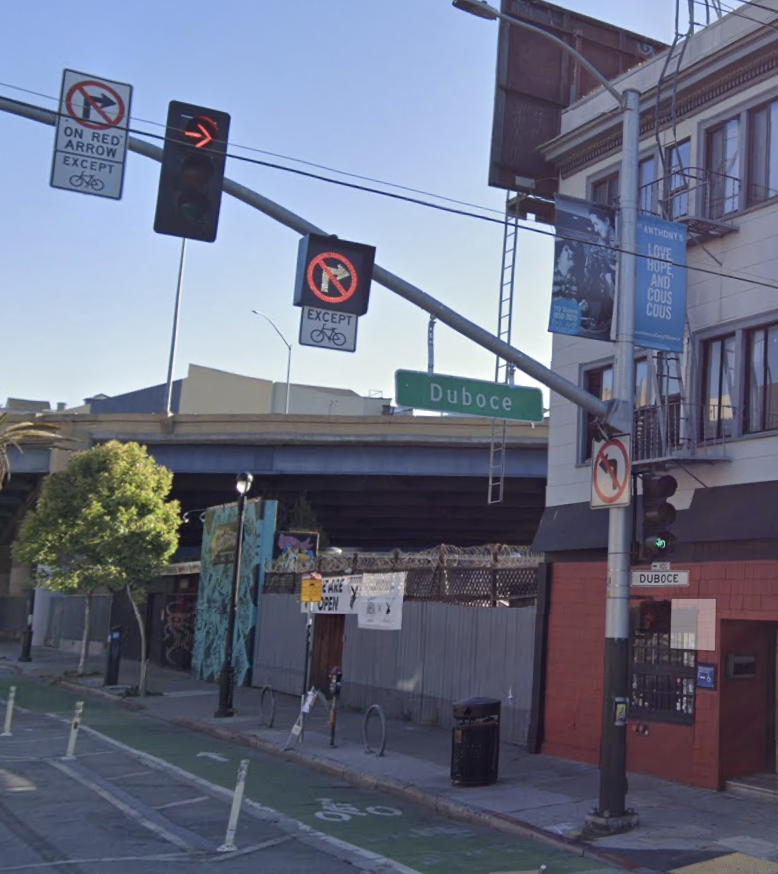 ECU the signs, google street view of valenca northbound at 14th in the car right-turn-lane, the bike lane to it’s rightleft most, a standard reflective paint metal sign on a light post over the street: no right turn on red except for bikescenter: a stoplight with a red arrow indicating that cars need to stop and wait for the green signalright: a back-lit LED version of same sign on the leftright-most a green/red stoplight for bicyclists that you should definitely ignore if you are one, and instead assume a car is about to turn right on red into you