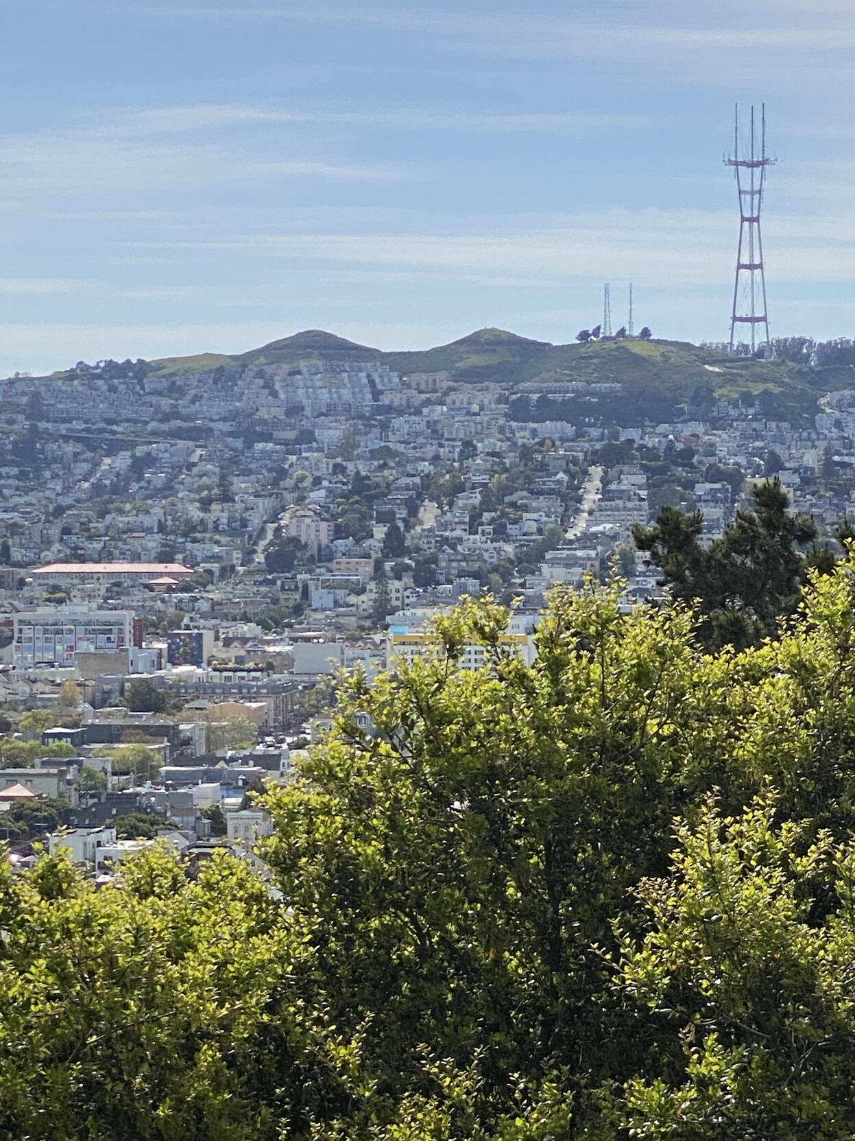 picture of Twin Peaks next to Sutro Tower from McKinley Square, from which the side by side paid actually look like twins