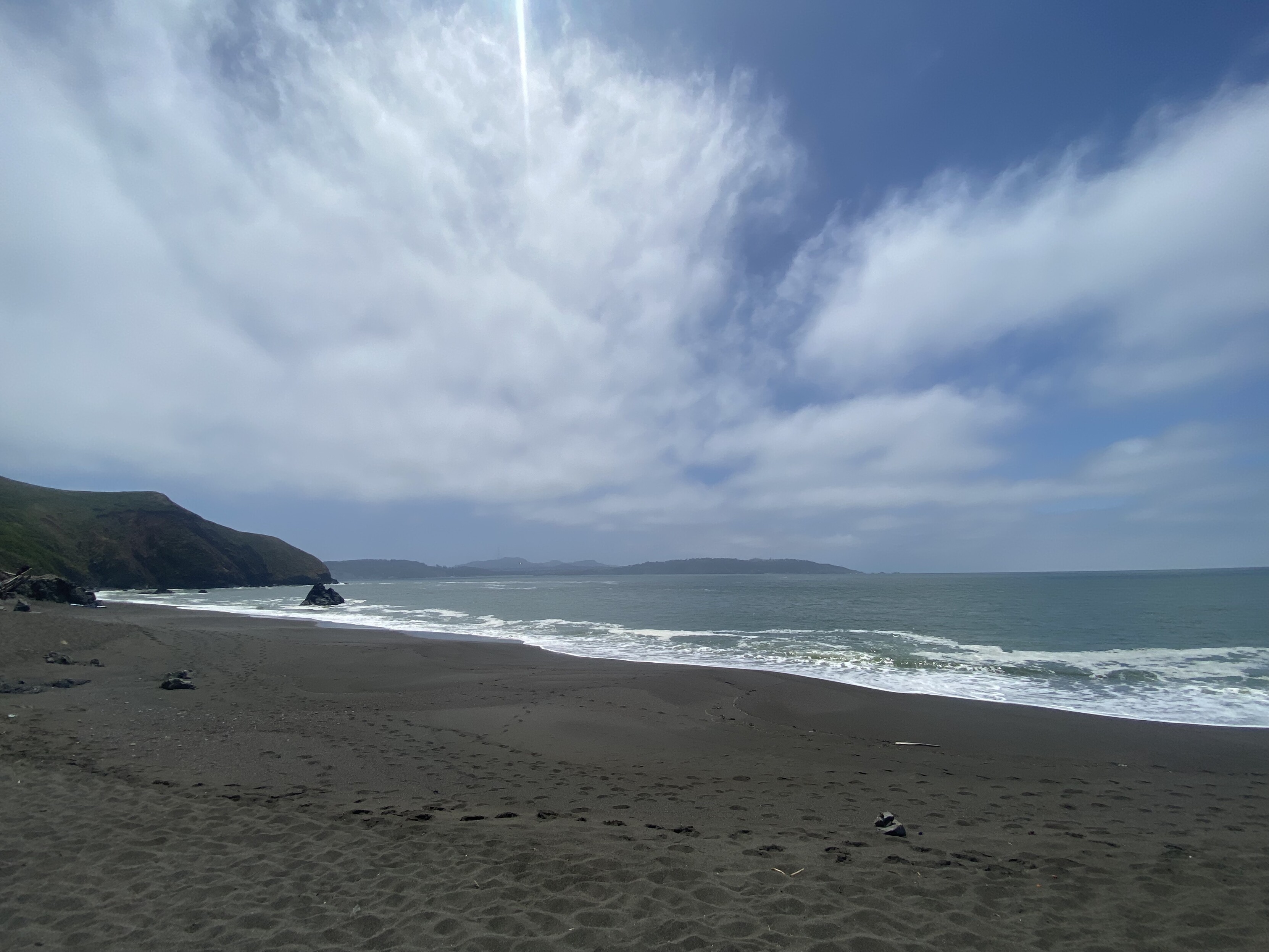 sutro tower beyond the pacific ocean from black sands beach