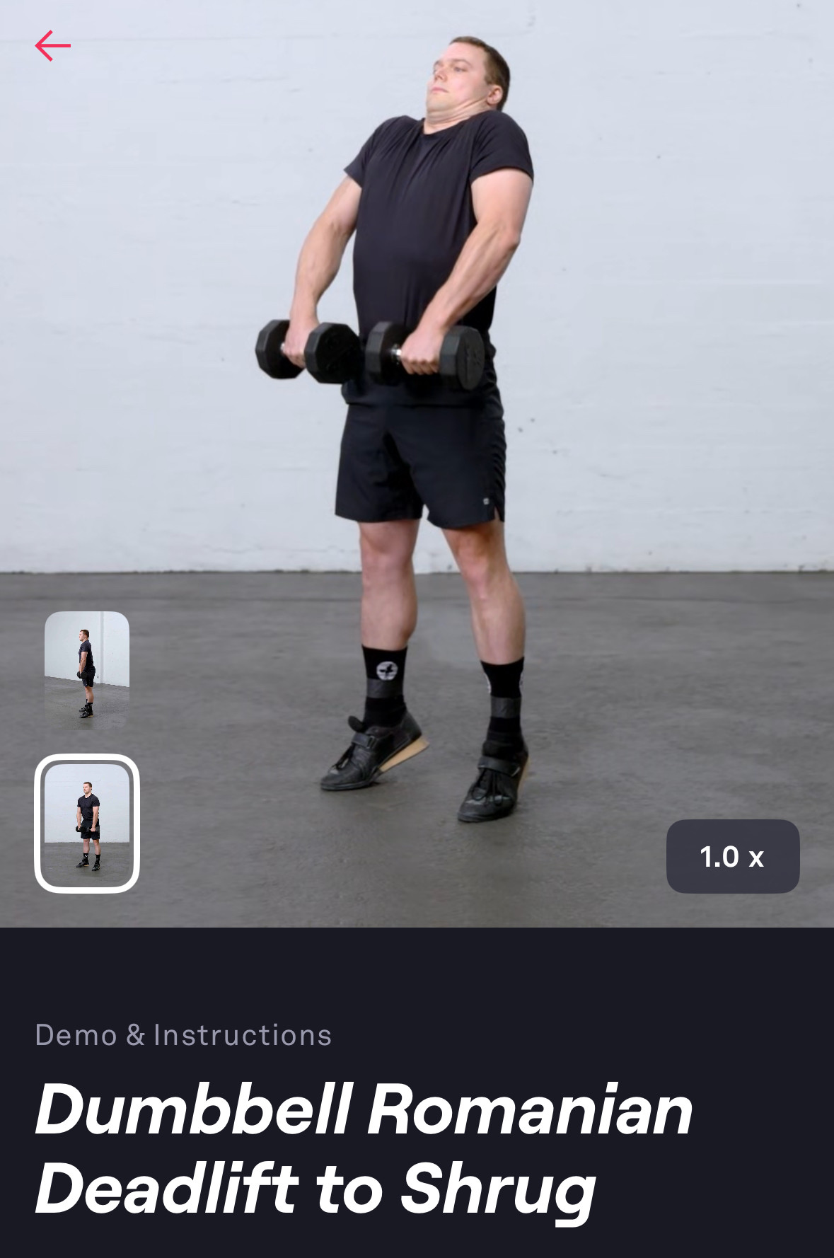 a screenshot of fitbod.app video instructions for a compound deadlift move that ends in a shruga man in black shorts, a black shirt, black tennis shoes, and black socks holding dumbbells in both hands is paused mid-shrugunder the photo, the app describes this move:Demo & InstructionsDumbbell RomanianDeadlift to Shrug