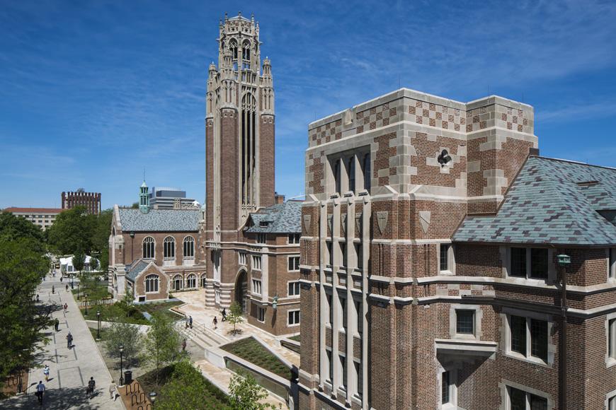 photograph of a brick church seminary on a partly cloudy day from 50 foot up looking down and across the entanceThe former Chicago Theological Seminary building located at 5757 South University Avenue was adaptively reused to house instructional and research programs for the Department of Economics and the office, conference, and research facilities for the Becker Friedman Institute for Research in Economics. The 100,770 gross square foot main building was renamed the Saieh Hall for Economics in June 2014. The renovation began in Fall 2012 and encompassed repairs and upgrades to the building envelope, HVAC and electrical and voice/data systems, and bringing the building infrastructure up to all required life/safety and accessibility codes. New space was constructed below grade for mechanical rooms and a large tiered lecture hall. To connect the east and west existing buildings at the ground level, a new building entrance was constructed by vacating the alley exiting to 58th Street. Construction was completed in June 2014. from: https://facilities.uchicago.edu/construction/5757south-university/