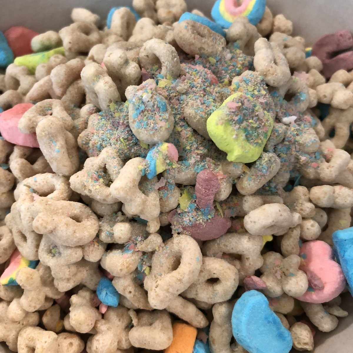 a bowl of Lucky Charms from the last of the box, topped with charm dust