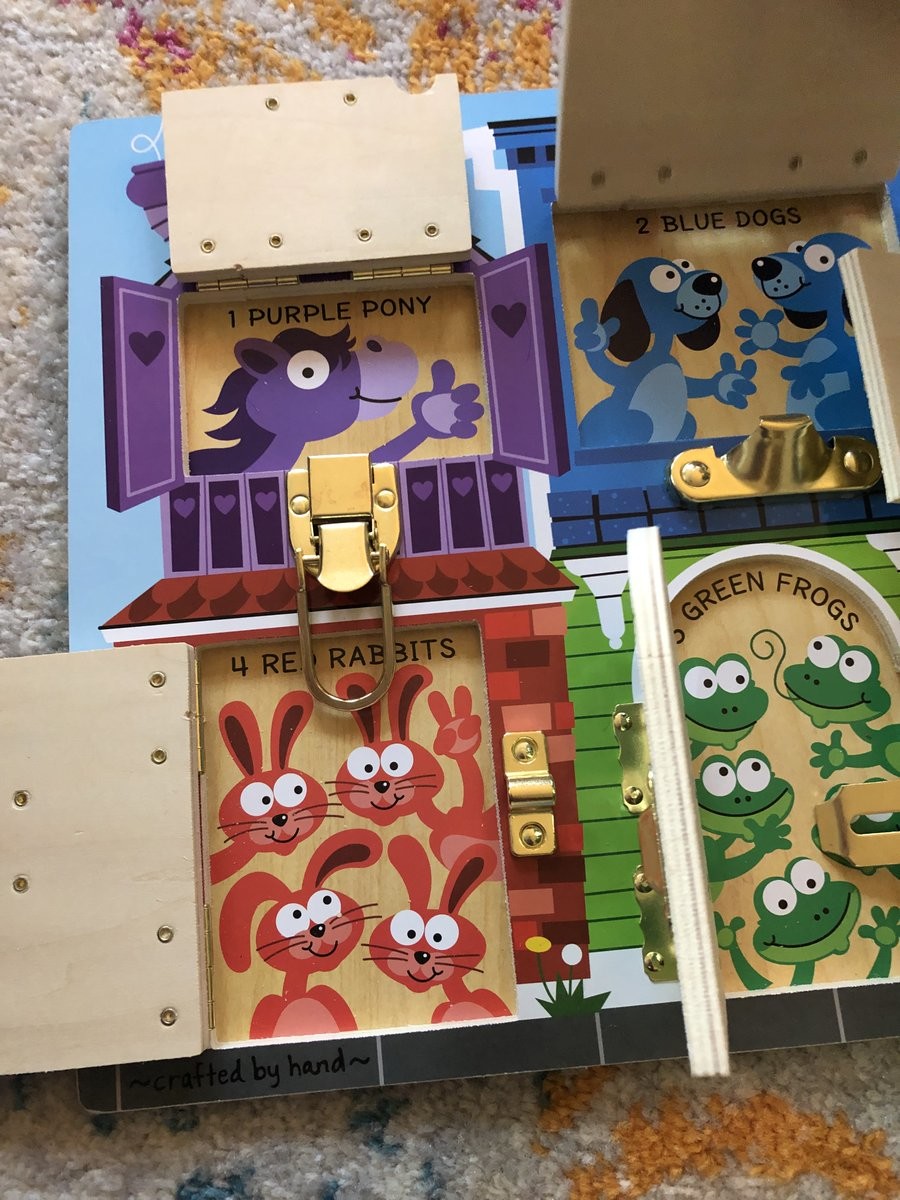 crop, child’s wooden door and latch board toy, 1 purple pony, 2 blue dogs, 4 red rabbits, 5 green frogs