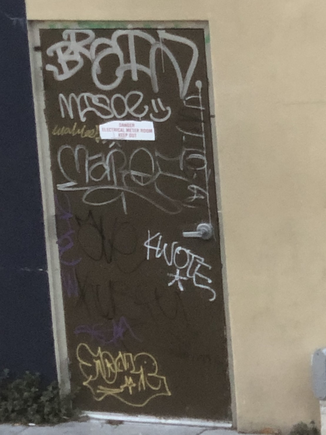 tags on a door by KWOTE, BRAIN, MISOE, MAROE, and others