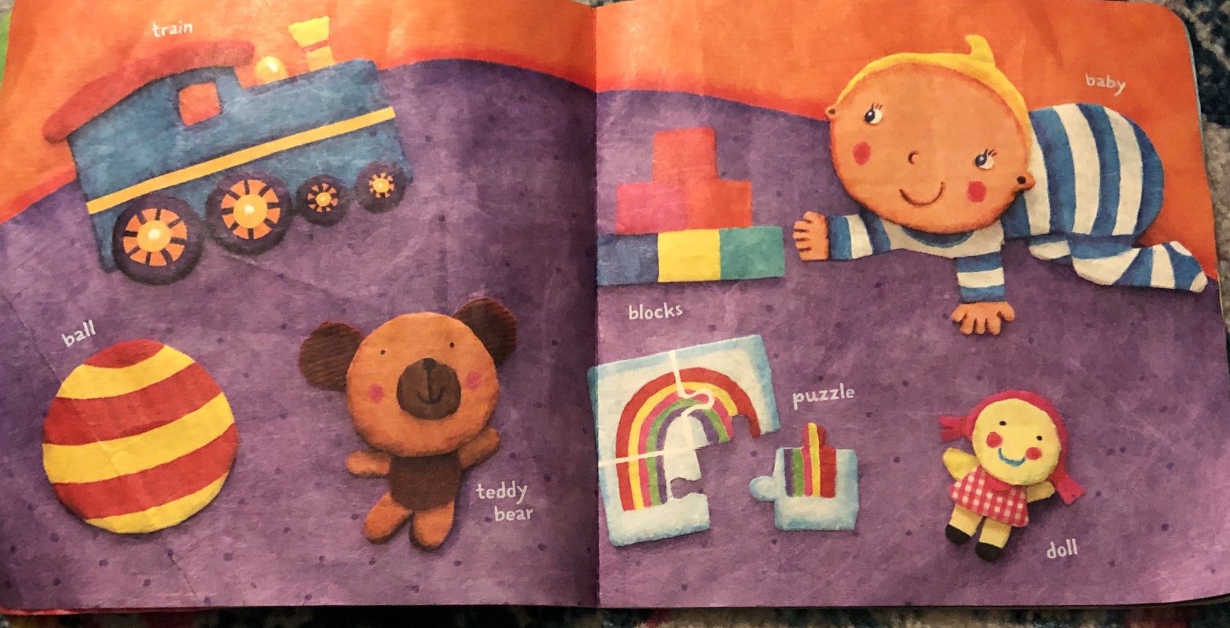 children book of words with illustrations: train, ball, teddy bear, blocks, puzzle, baby, doll