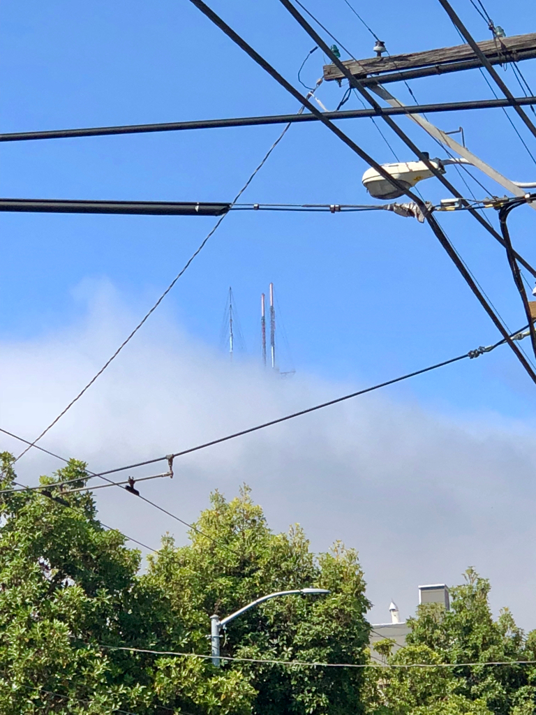 all but the top of Sutro Tower obscured nu fog